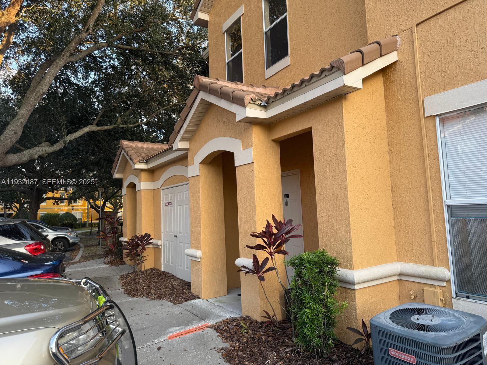 19914 Villa Creek Drive, Unit 202 Orlando, FL 32821 - Photo 19 of 19 a front view of a house with garden
