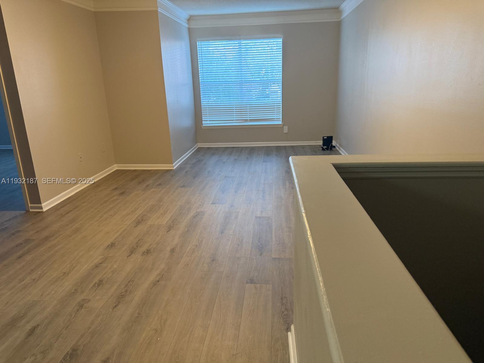 19914 Villa Creek Drive, Unit 202 Orlando, FL 32821 - Photo 5 of 19 an entryway with wooden floor