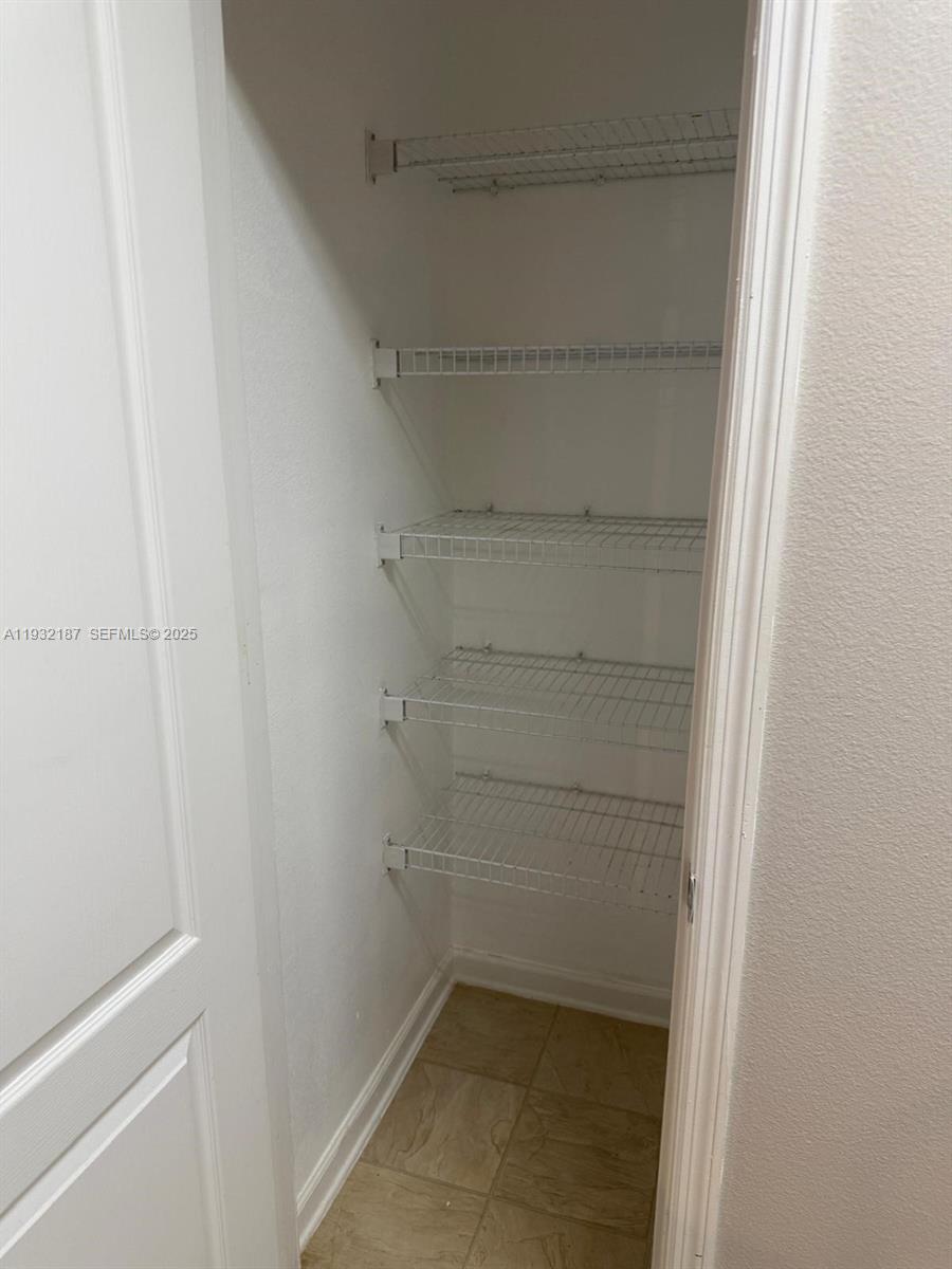 19914 Villa Creek Drive, Unit 202 Orlando, FL 32821 - Photo 6 of 19 a view of walk in closet