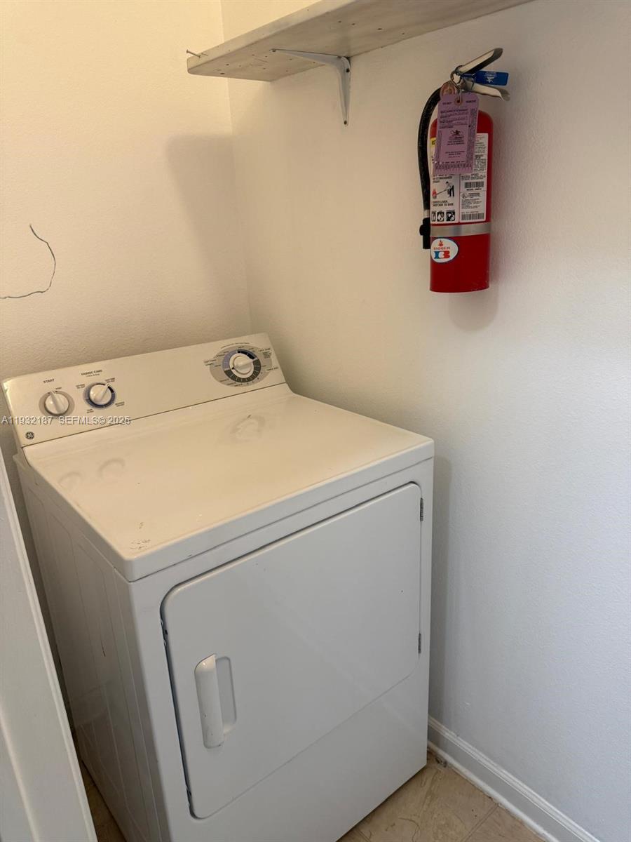 19914 Villa Creek Drive, Unit 202 Orlando, FL 32821 - Photo 7 of 19 a utility room with dryer and washer