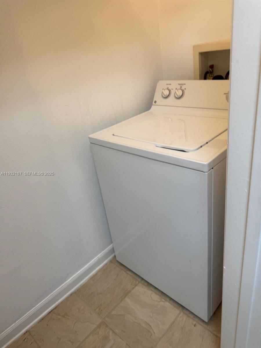 19914 Villa Creek Drive, Unit 202 Orlando, FL 32821 - Photo 8 of 19 a utility room with dryer and washer