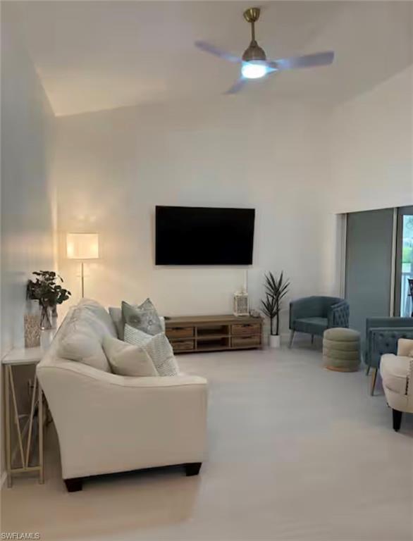 14993 Rivers Edge Court, Unit 246 Fort Myers, FL 33908 - Photo 3 of 23 a living room with furniture and a flat screen tv