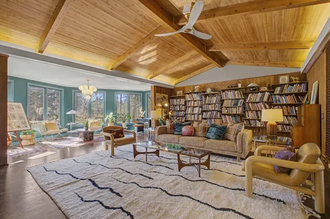 a living room with furniture and a rug