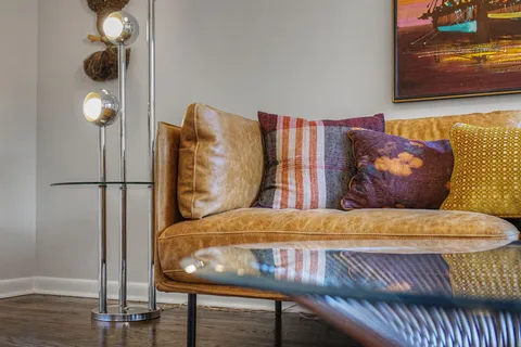 a room with a couch and a fireplace