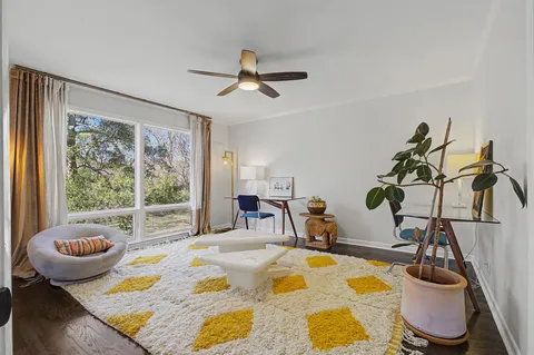 a spacious bedroom with a bed and a couch