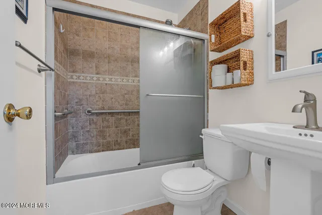 a bathroom with a shower and a toilet