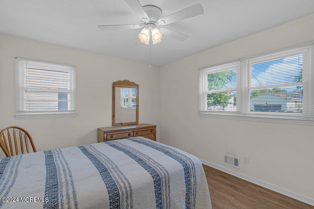 137 Marcellus Avenue Manasquan, NJ 08736 - Photo 14 of 17 a bedroom with a bed and a window