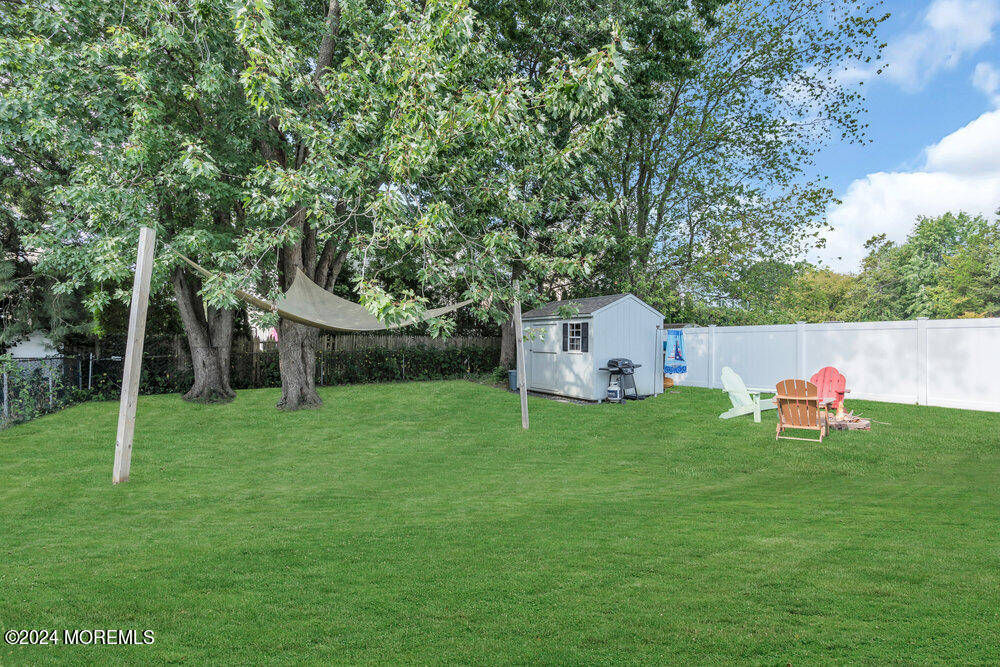 137 Marcellus Avenue Manasquan, NJ 08736 - Photo 17 of 17 a backyard of a house with table and chairs