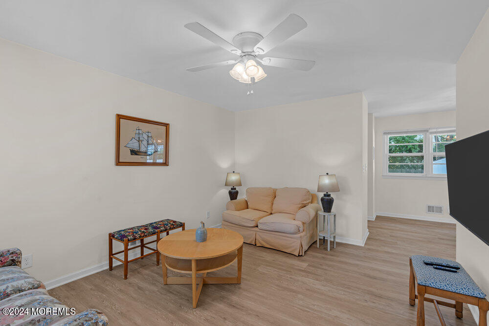 137 Marcellus Avenue Manasquan, NJ 08736 - Photo 3 of 17 a living room with furniture and a flat screen tv
