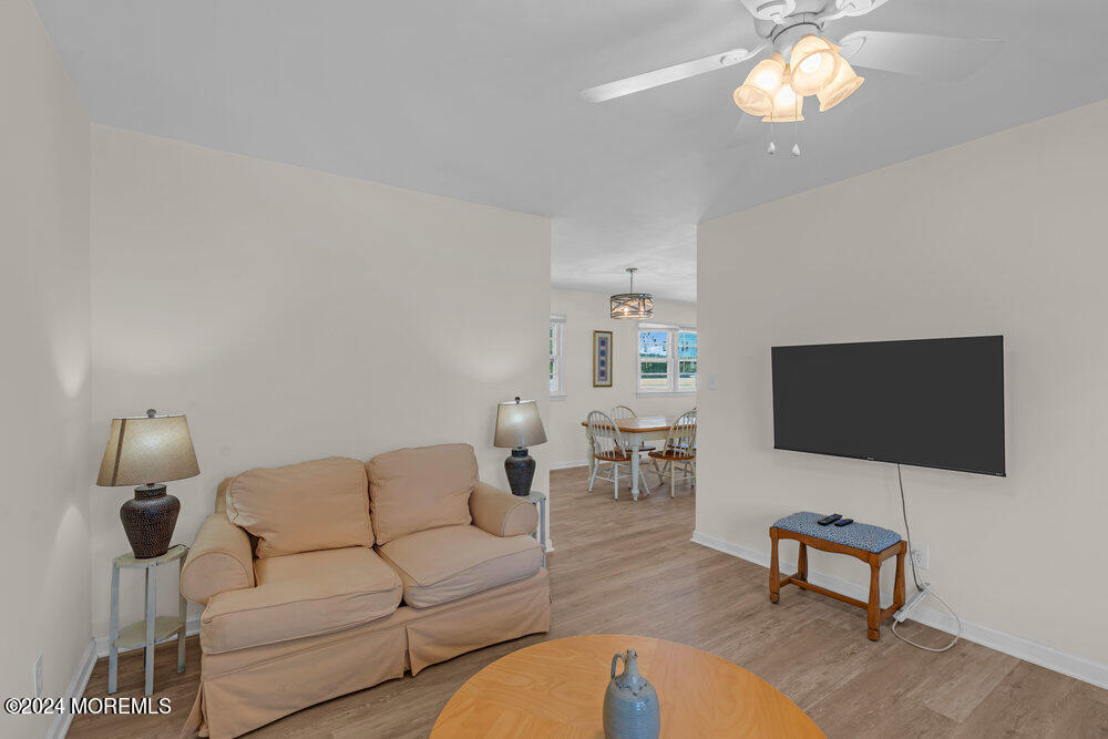 137 Marcellus Avenue Manasquan, NJ 08736 - Photo 4 of 17 a living room with furniture and a flat screen tv