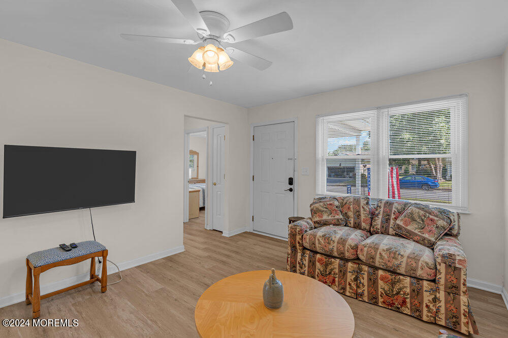 137 Marcellus Avenue Manasquan, NJ 08736 - Photo 5 of 17 a living room with furniture and a flat screen tv