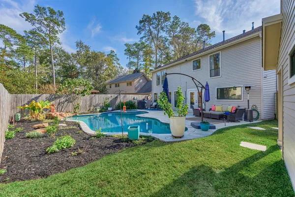 a kitchen with stainless steel appliances a refrigerator and a stove top oven