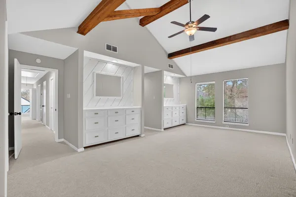 a view of a room with cabinet and mirror