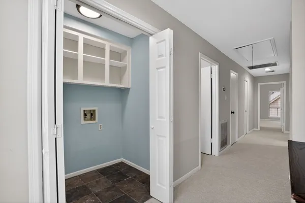 an empty room with a ceiling fan and a window