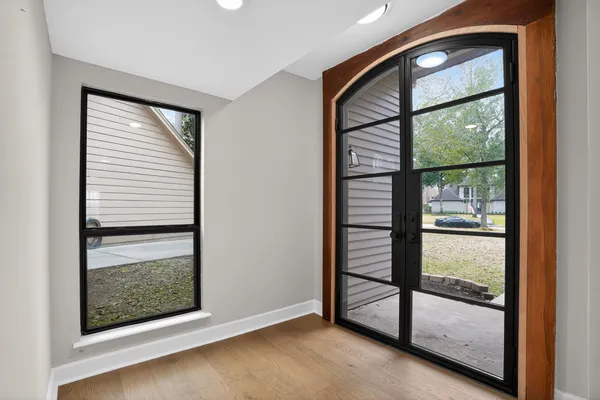 an empty room with large window