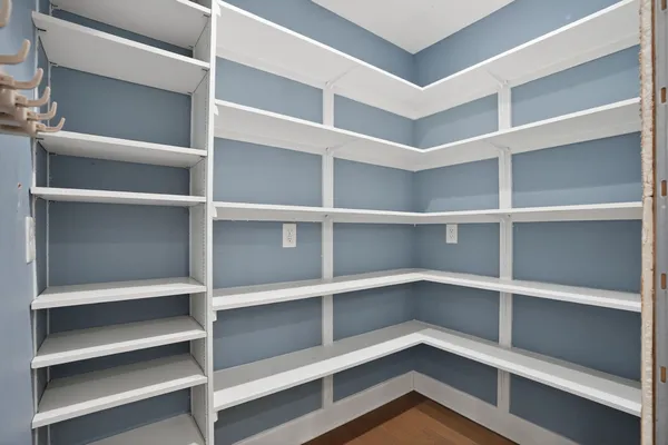 a kitchen with stainless steel appliances kitchen island a large counter space a sink and cabinets