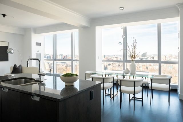 a view of a dining room with furniture window and outside view