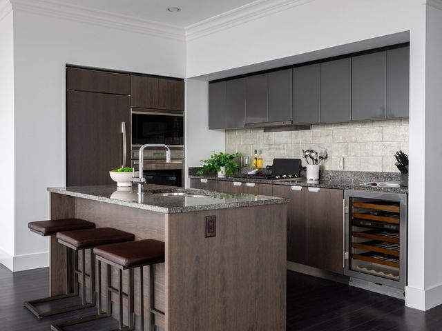a kitchen with a sink and refrigerator