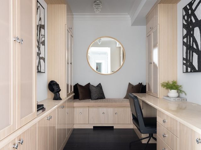 a hallway with a sink and a window