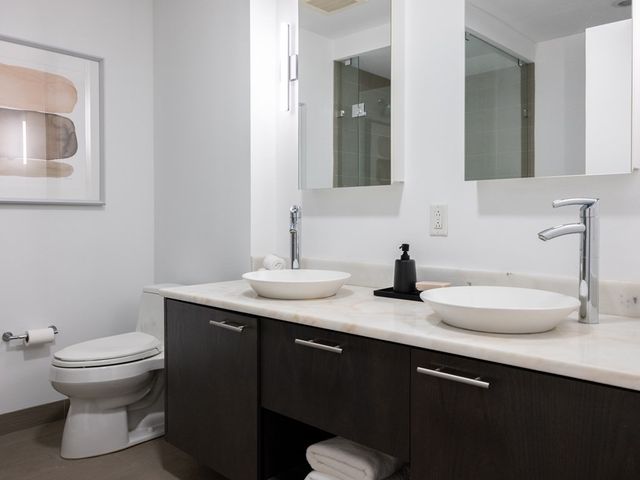 a bathroom with a shower and a sink