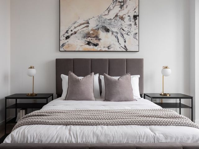 a bathroom with a granite countertop sink a toilet and shower