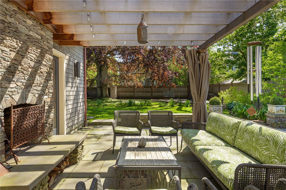 33 Everett Street Newport, RI 02840 - Photo 34 of 44 Outdoor living room with wood burning fireplace