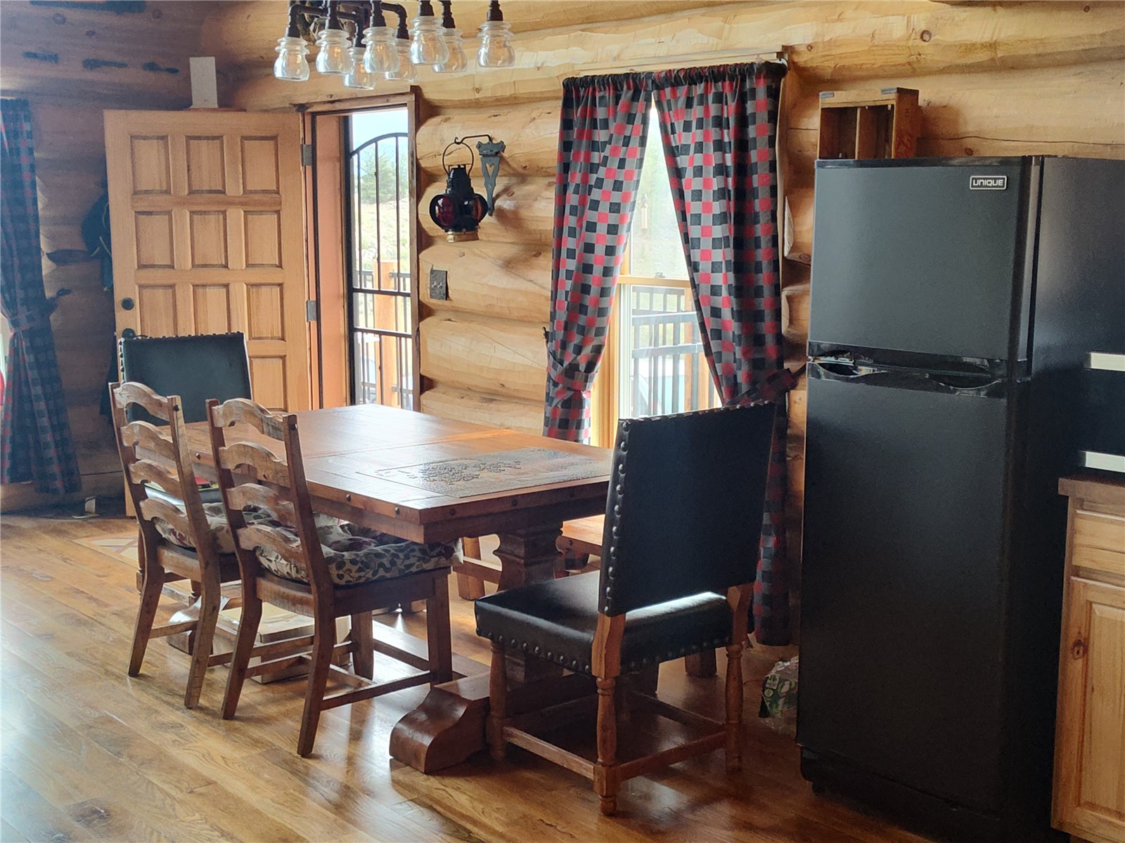 5 Arland Road Como, CO 80456 - Photo 9 of 33 a view of a dining room with furniture and wooden floor