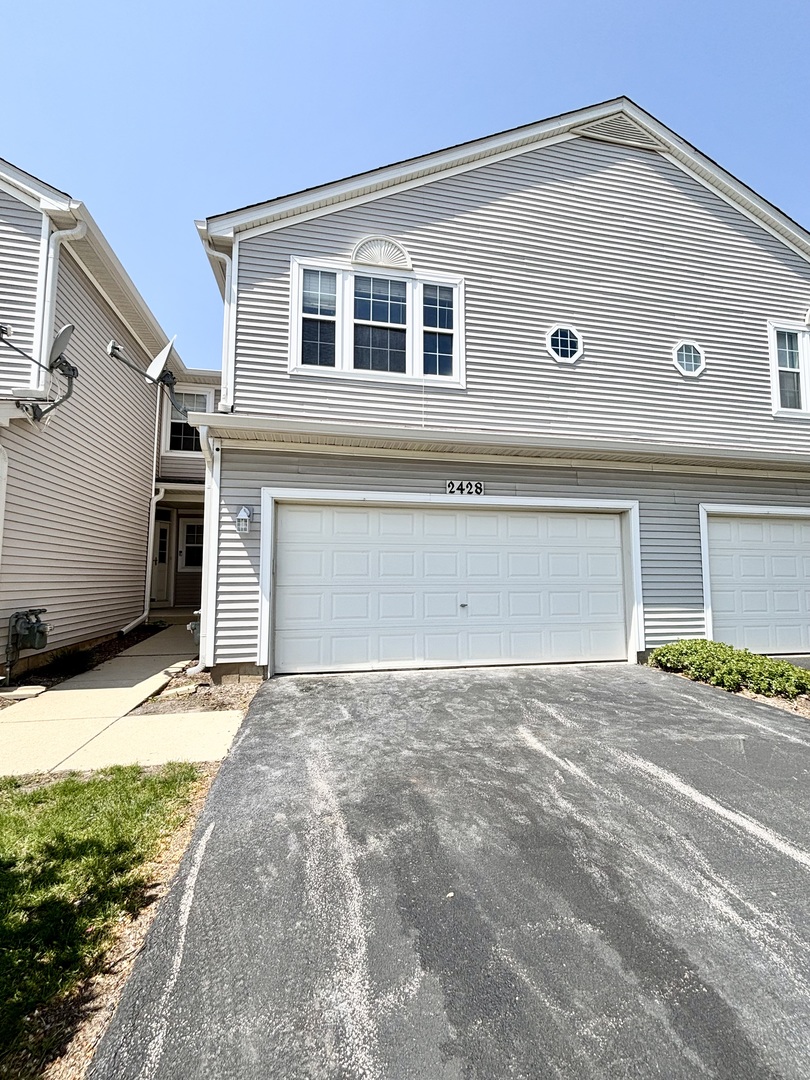 2428 Reflections Drive Aurora, IL 60502 - Photo 2 of 15 a view of garage