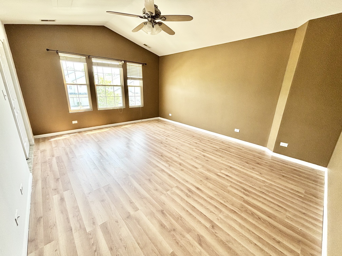 2428 Reflections Drive Aurora, IL 60502 - Photo 6 of 15 a view of an empty room with wooden floor and a window