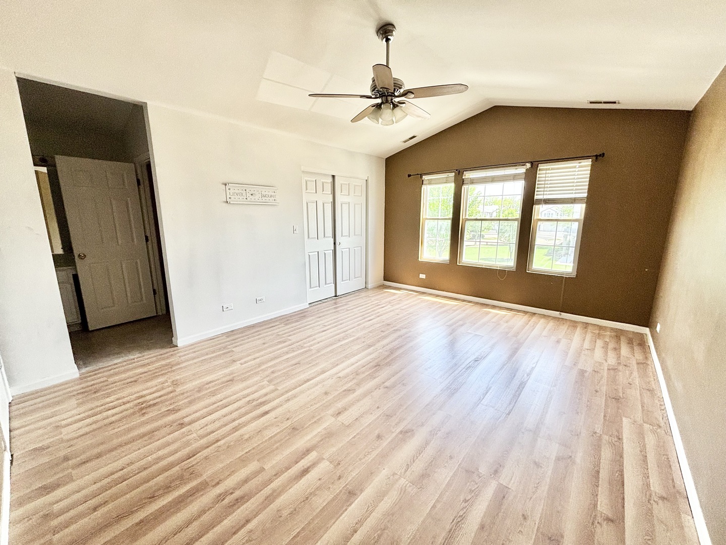 2428 Reflections Drive Aurora, IL 60502 - Photo 7 of 15 wooden floor in an empty room with a window