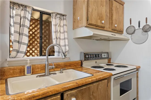 a kitchen with a sink and a window