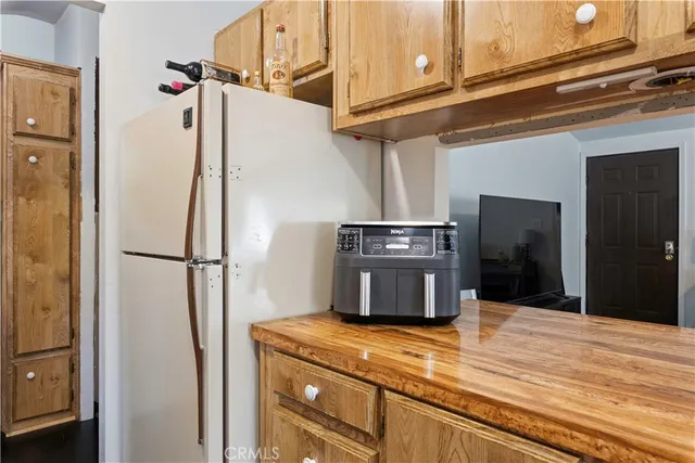 a kitchen with a stove and a refrigerator