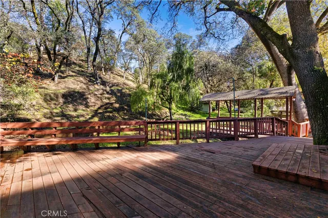 a view of a balcony with wooden floor