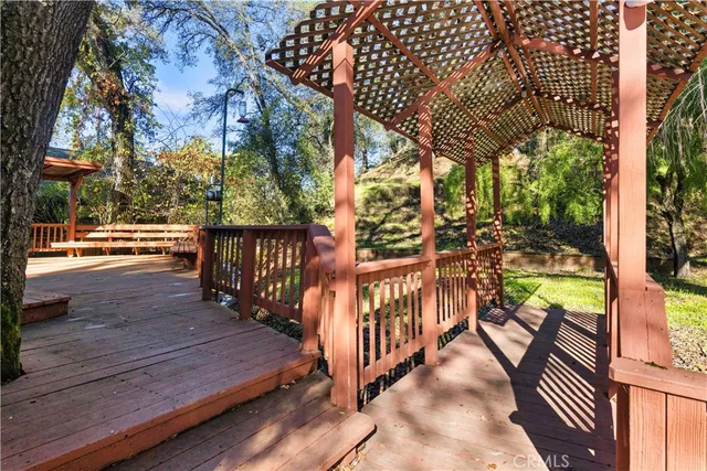 a view of a chair and table in the garden