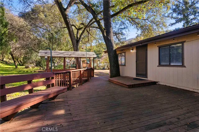 a view of a house with wooden deck