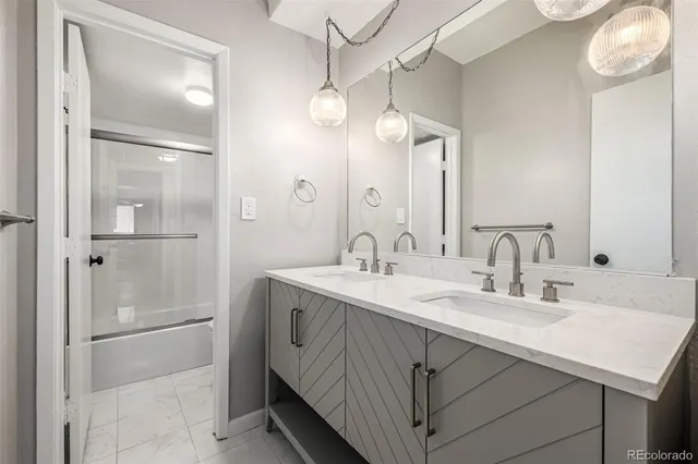 a bathroom with a sink vanity and a mirror
