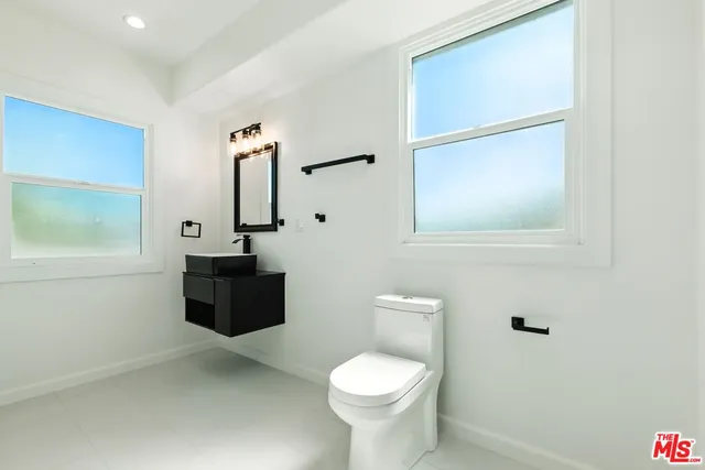 a bathroom with a glass shower door