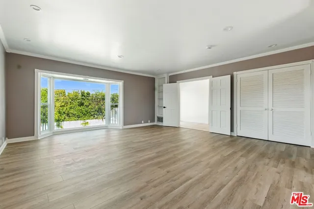 a view of hallway with window and hallway