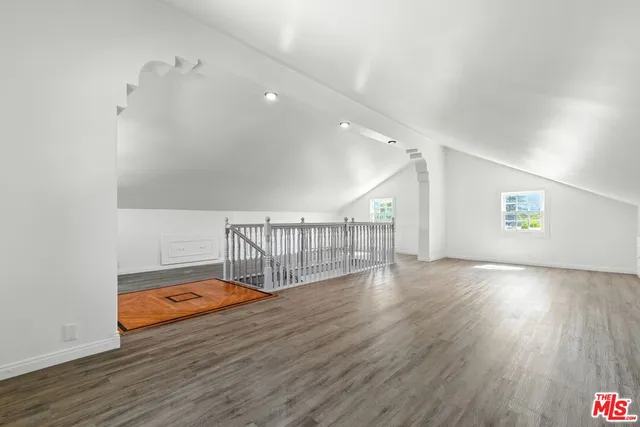 a view of hallway with wooden floor