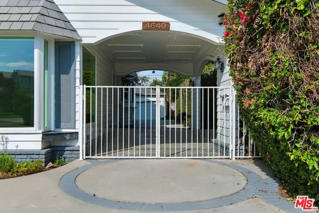 a view of a patio with table and chairs and potted plants