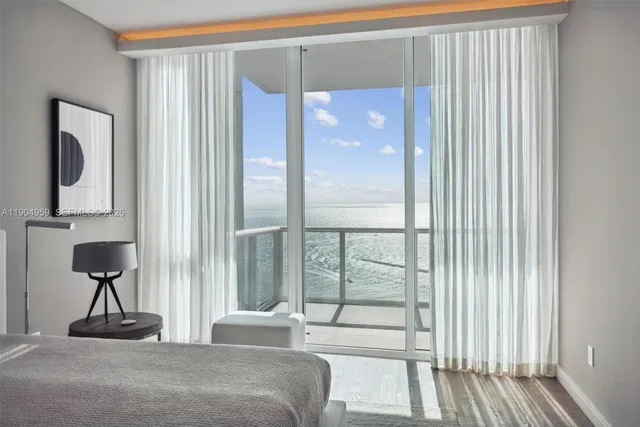 a view of swimming pool with outdoor seating and plants