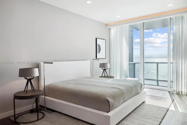 a view of a backyard with plants and outdoor seating