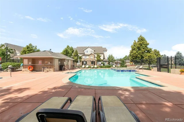 a view of a swimming pool with a yard