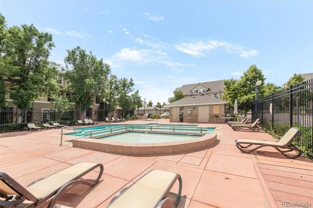 a view of a backyard with sitting area