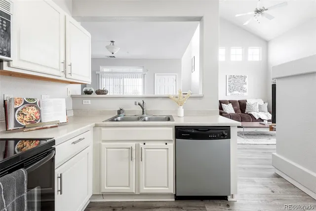 a kitchen with stainless steel appliances granite countertop a stove and a sink
