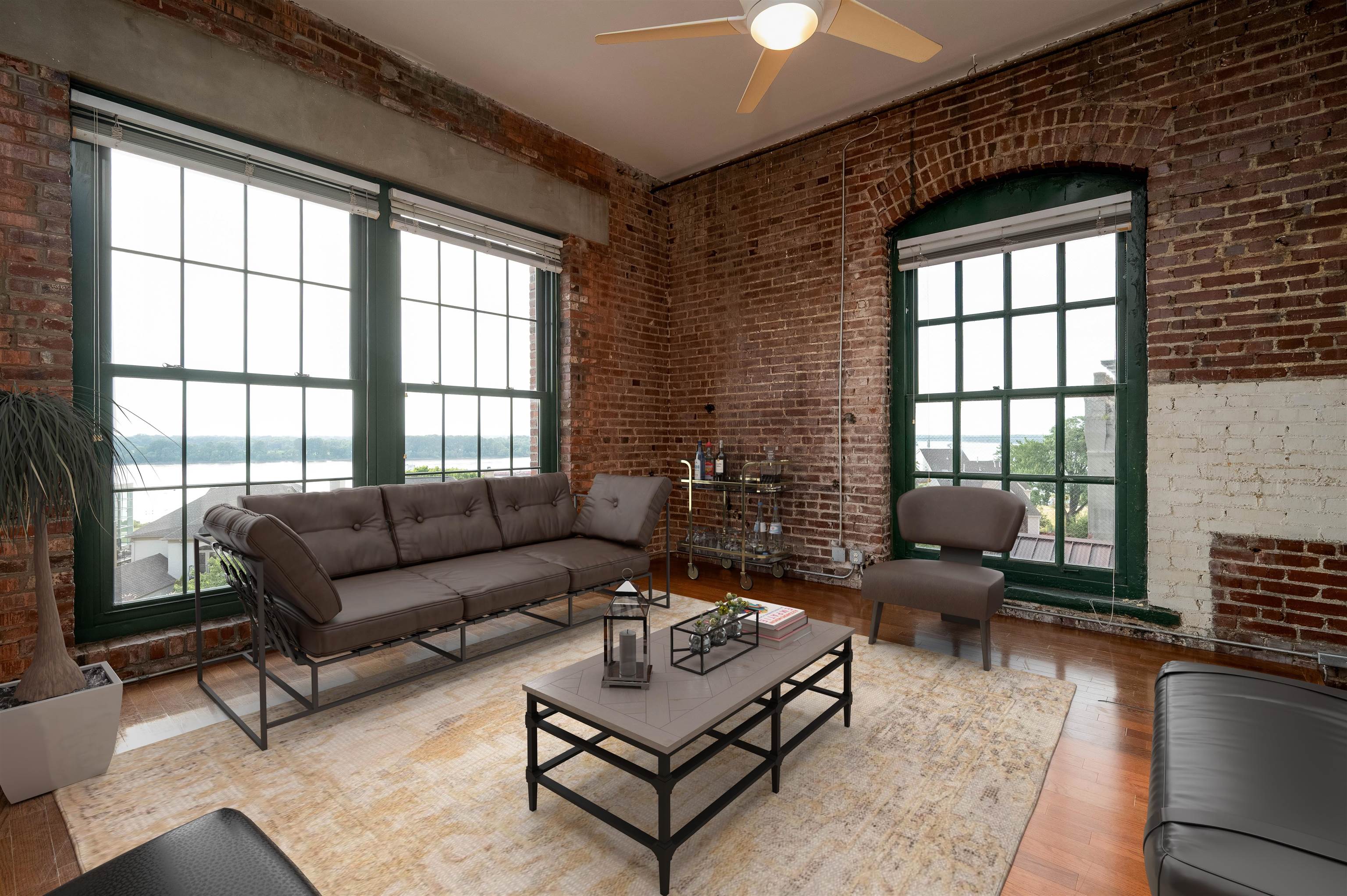 505 Tennessee Street, Unit 428 Memphis, TN 38103 - Photo 1 of 29 a living room with furniture and a large window