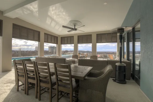 a dining room with furniture window and outside view