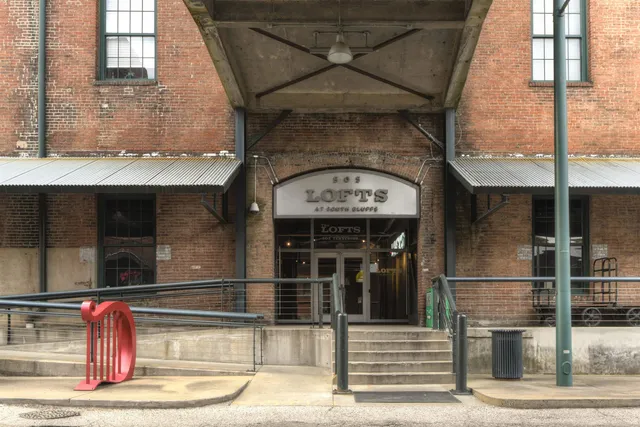 a front view of a building with a street
