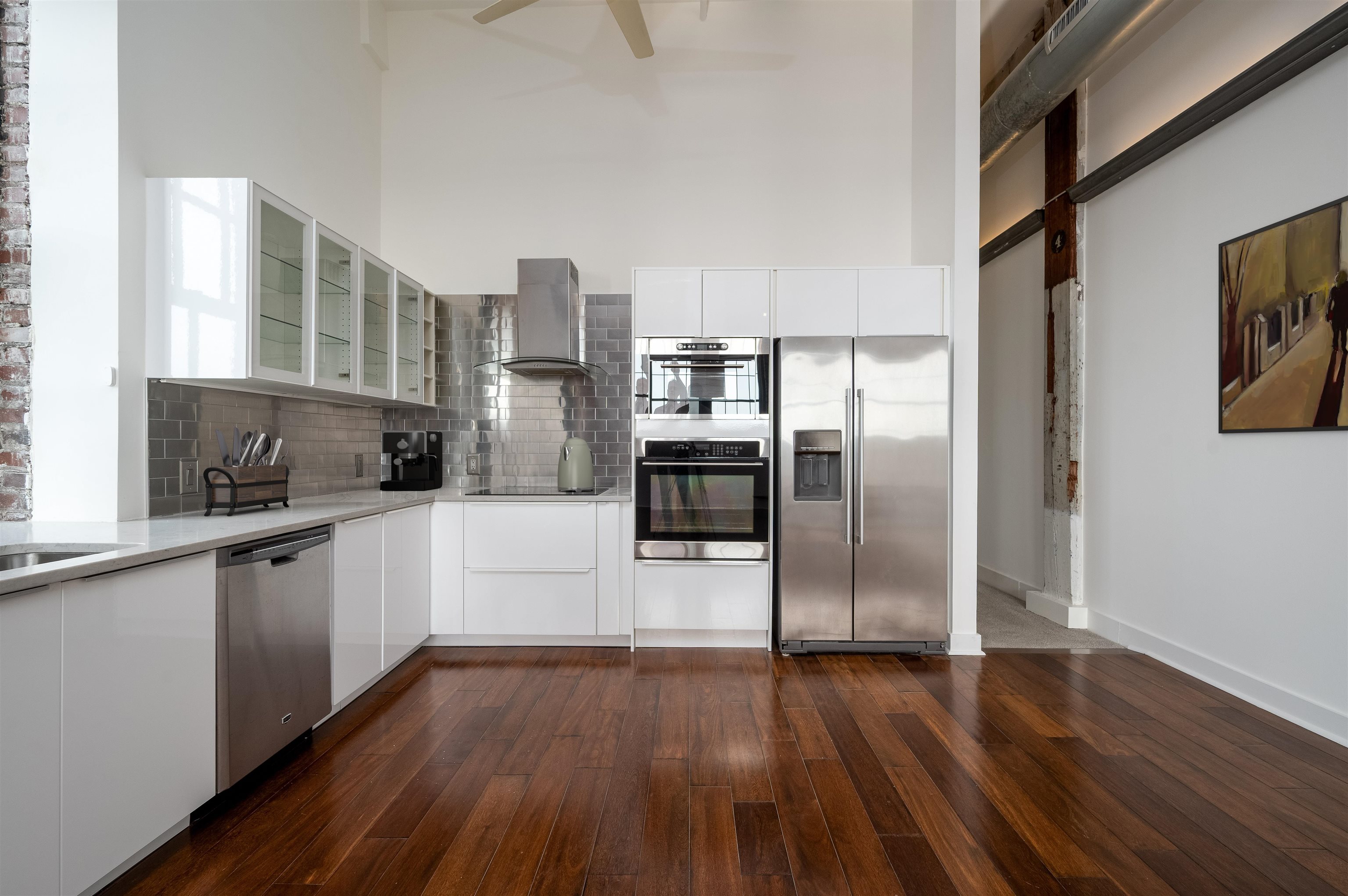 505 Tennessee Street, Unit 428 Memphis, TN 38103 - Photo 10 of 29 a kitchen with stainless steel appliances a refrigerator and a stove top oven