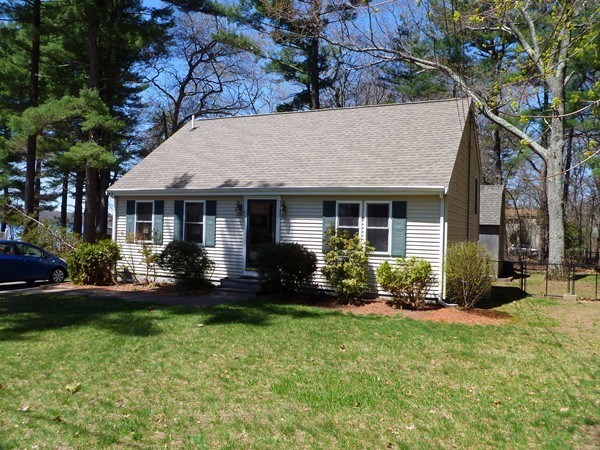 47 Evergreen Road Norton, MA 02766 - Photo 2 of 17 a front view of a house with a garden and porch